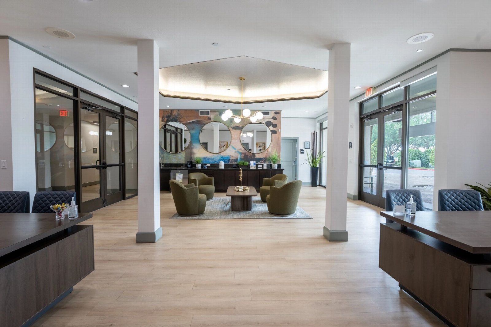 Open-plan clubroom with columns, a domed ceiling detail and a bar counter.